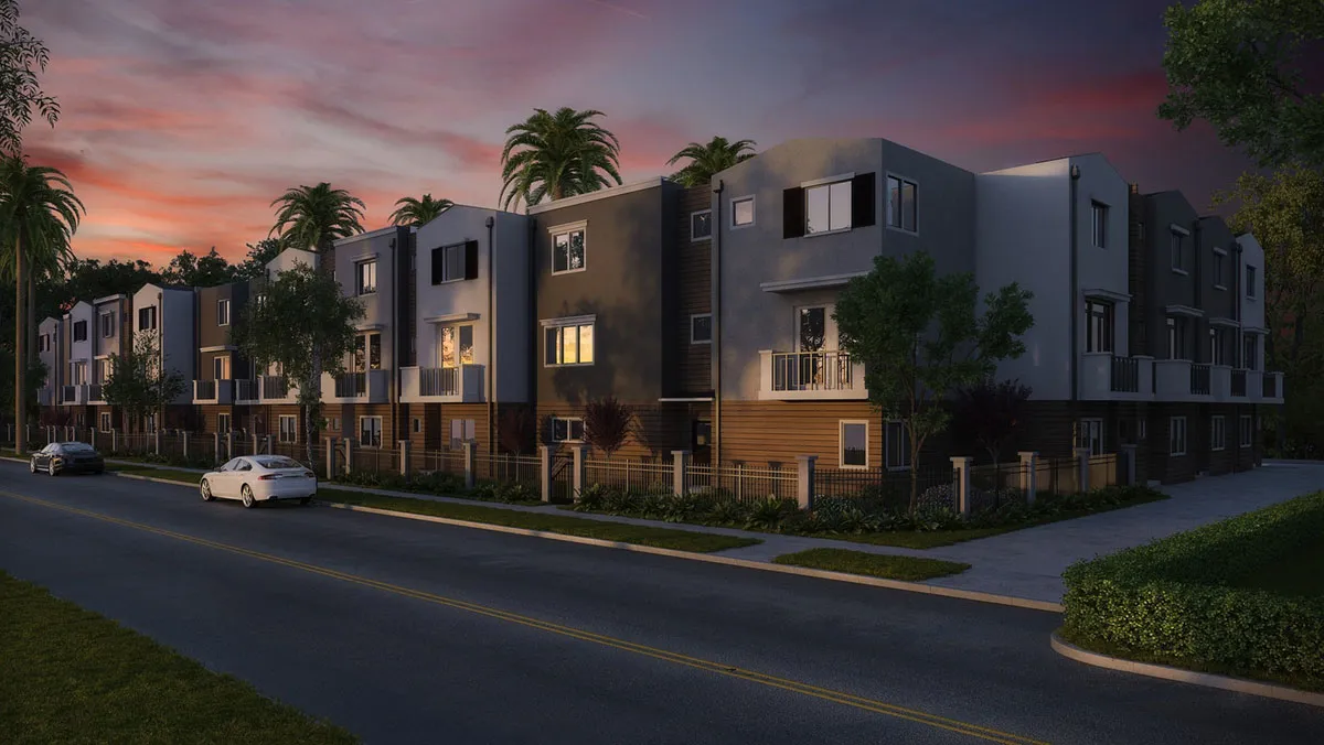 A row of modern townhomes along a street at dusk